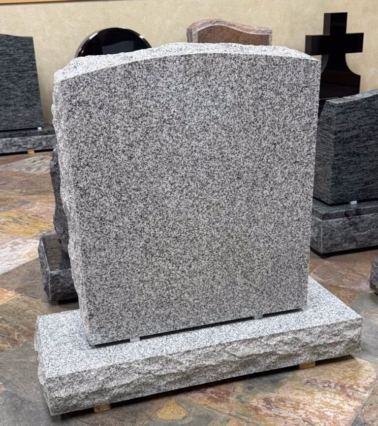 Monument with Rock Pitched Edges in Southern White Granite