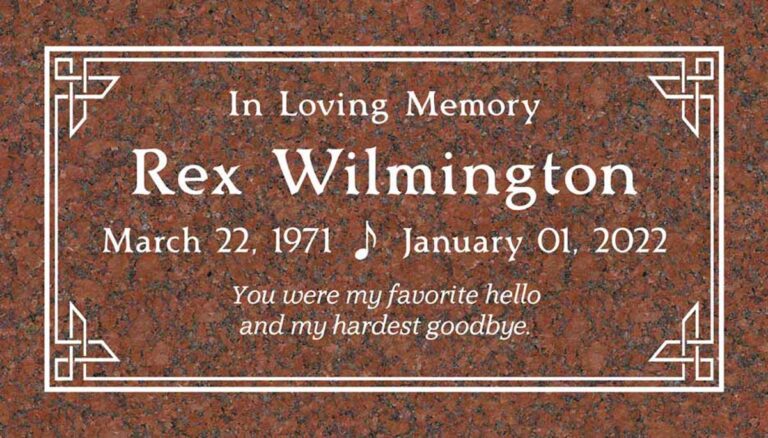 Granite grave marker with celtic knot corners and art deco double-line border