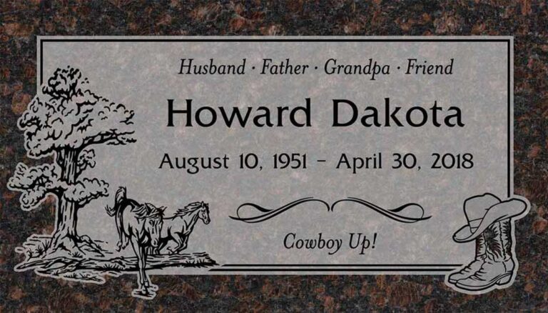 Granite grave marker with horse under oak tree, cowboy boots, and hat