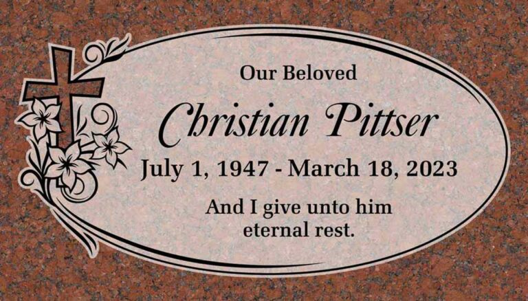 Granite grave marker with cross, flowers, oval border, and scrollwork