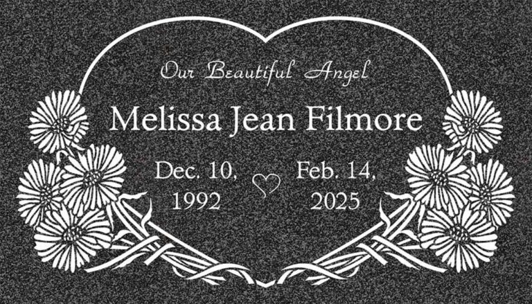 Granite grave marker with heart outline and daisy flowers