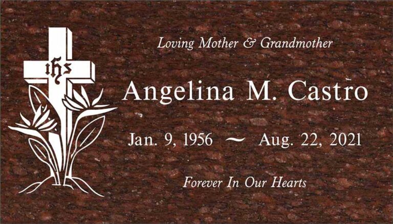 Granite grave marker with IHS cross and bird of paradise flowers