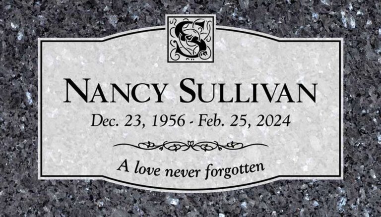 Granite grave marker with monogram initial, scroll divider, and arched top panel