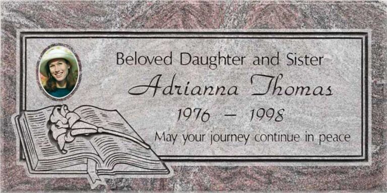 Granite grave marker with photo portrait and open bible