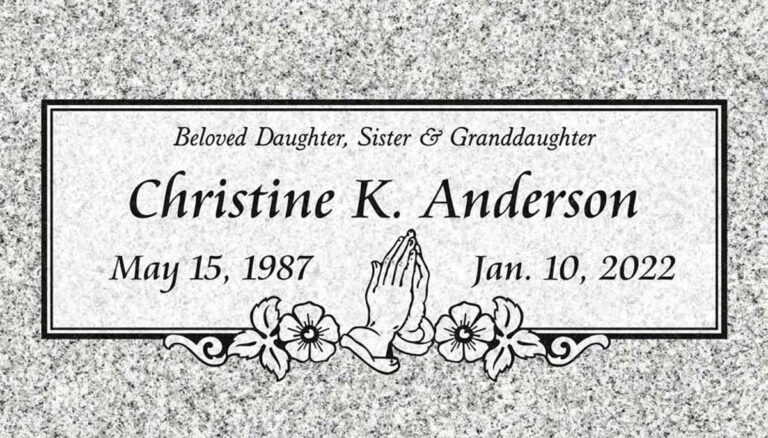 Granite grave marker with praying hands, flowers, and double border