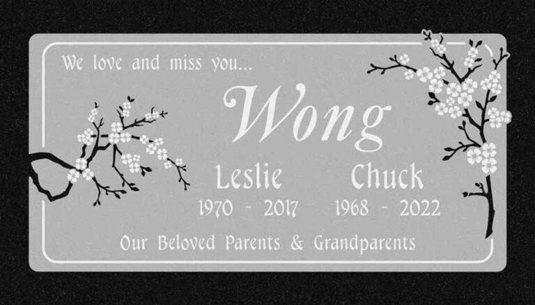 Granite companion gravestone with cherry blossom branches and frosted panel