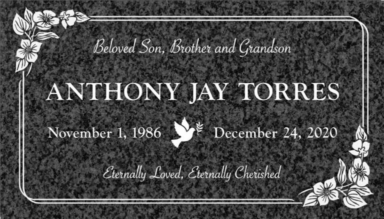 Granite gravestone with dove, hibiscus flowers, and rounded border