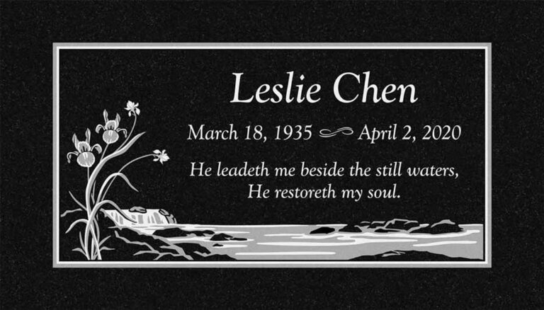Granite gravestone with iris flowers, stream, and landscape scene