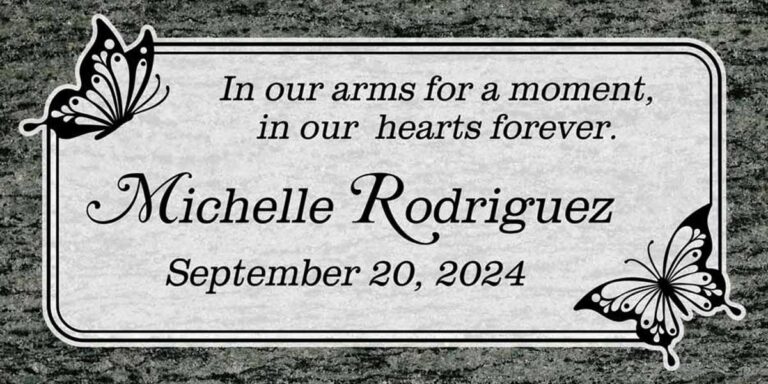 Granite headstone with butterflies and double border with rounded corners