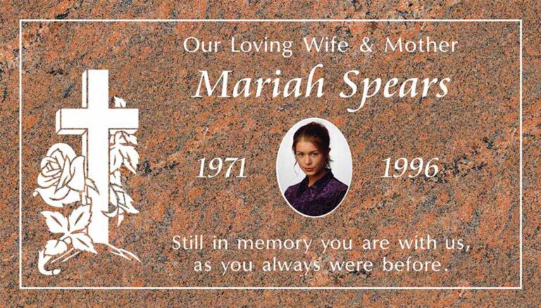Granite headstone with cross, rose, and portrait cameo