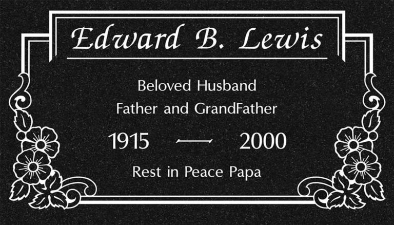 Granite headstone with flowers and scrollwork in all four corners
