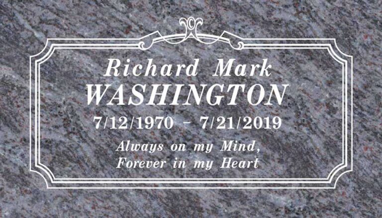 Granite headstone with ornate scrollwork border and fleur-de-lis accent