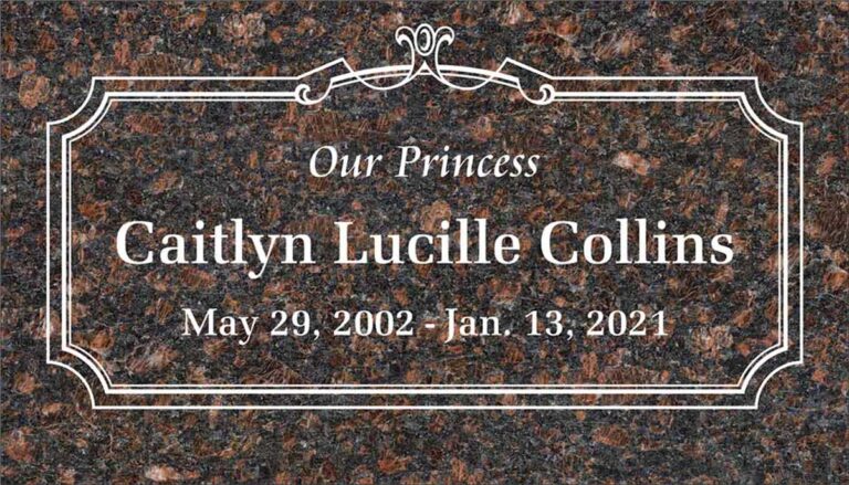 Granite headstone with ornate scrollwork and elegant frame
