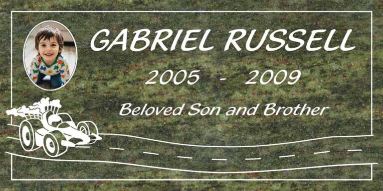 Granite headstone with portrait, race car, and winding road