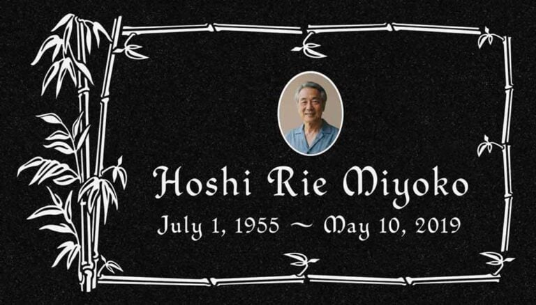 Granite memorial with bamboo stalk border and oval photo portrait