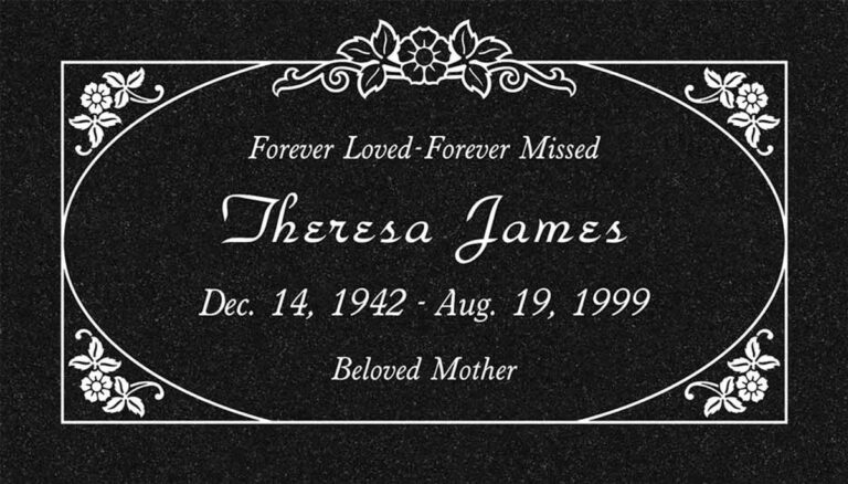 Granite memorial with frosted oval panel, flower bouquet, and corner accents