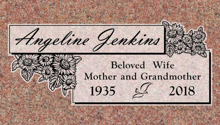 Granite memorial with sunflower bouquet and stacked banner panels