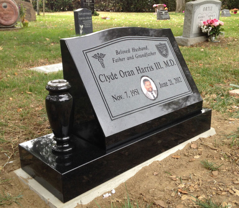 Granite slant memorial with porcelain portrait and medical caduceus emblem and vase column at Oak Park Cemetery in Claremont