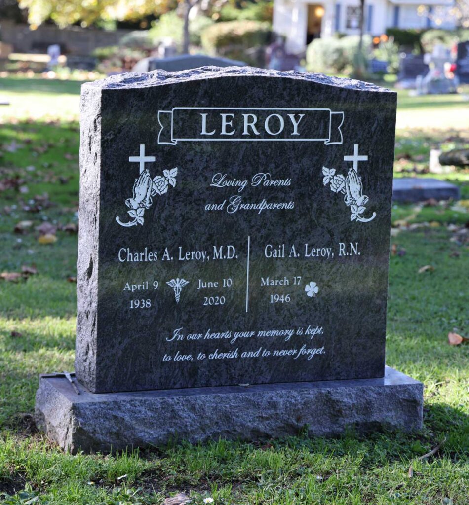 Companion granite monument with crosses and praying hands and rock-pitched edges at Oak Park Cemetery in Claremont