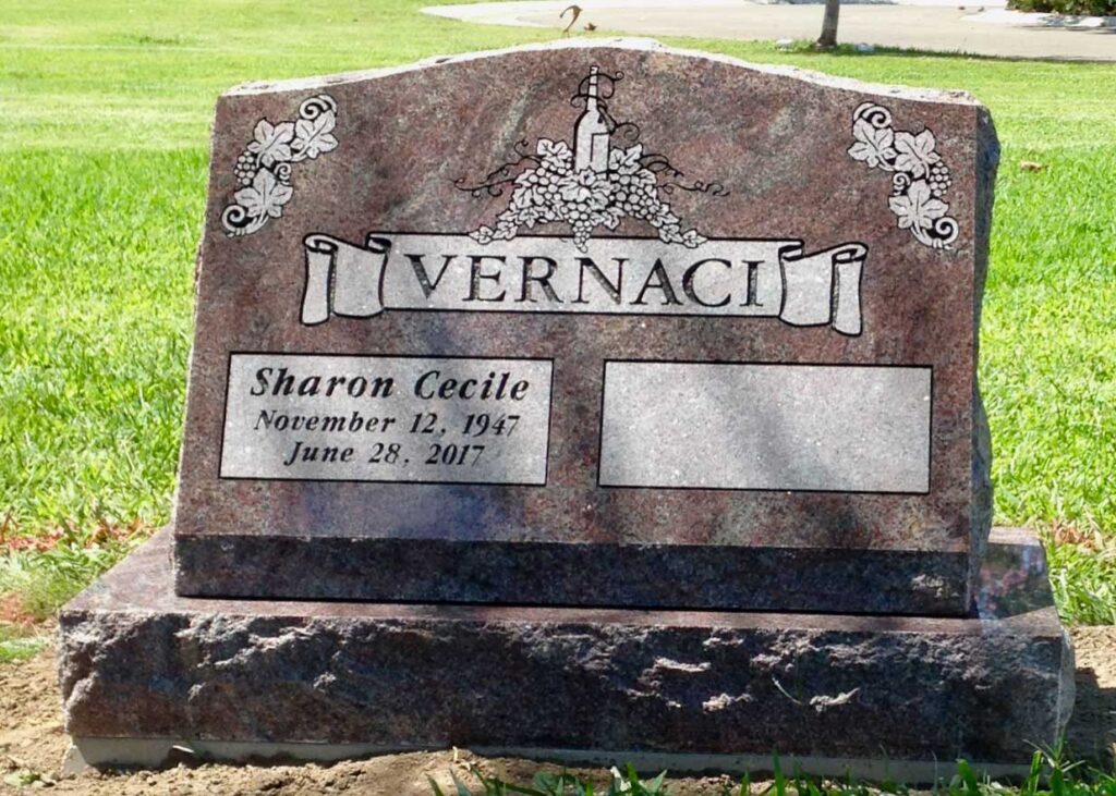 Granite slant memorial with grapevine and banner design at Oak Park Cemetery in Claremont