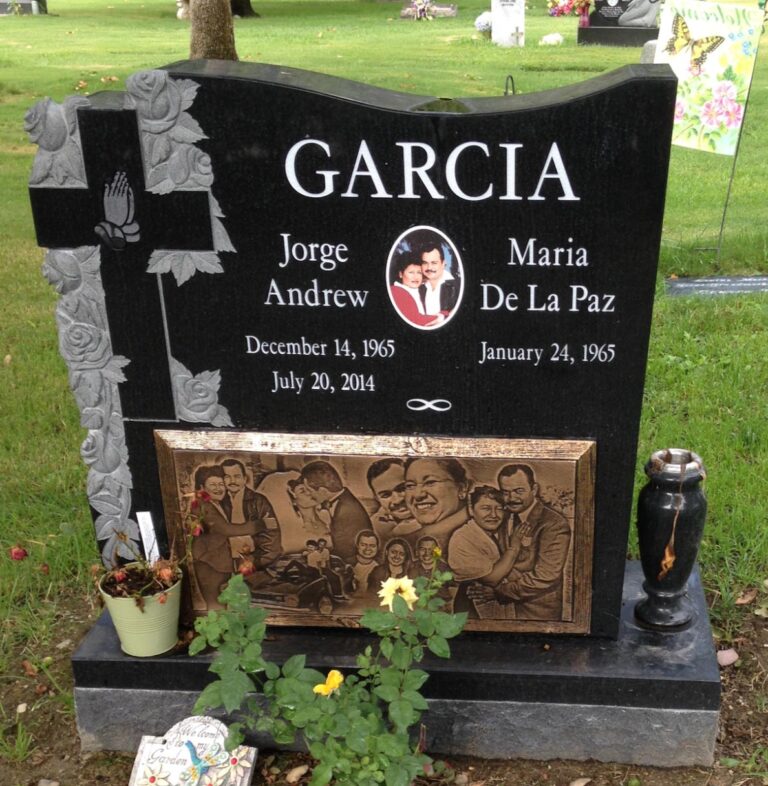 Companion granite monument with sculpted roses and praying hands and bronze photo panel at Oak Park Cemetery in Claremont
