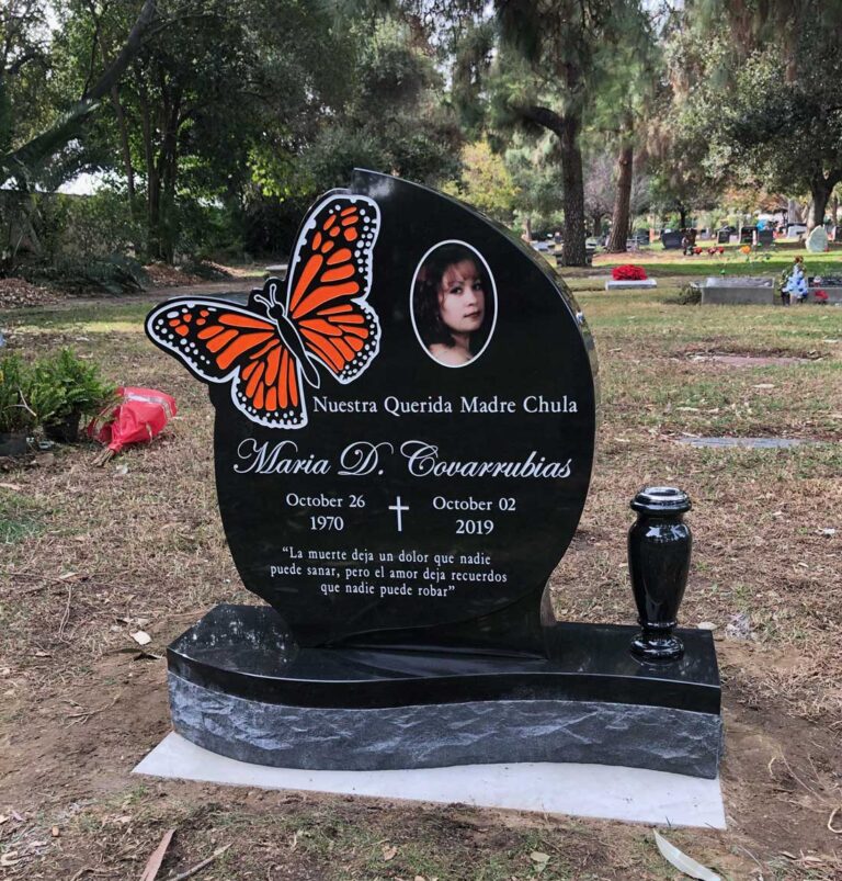 Granite monument with monarch butterfly color painting and porcelain portrait at Oak Park Cemetery in Claremont