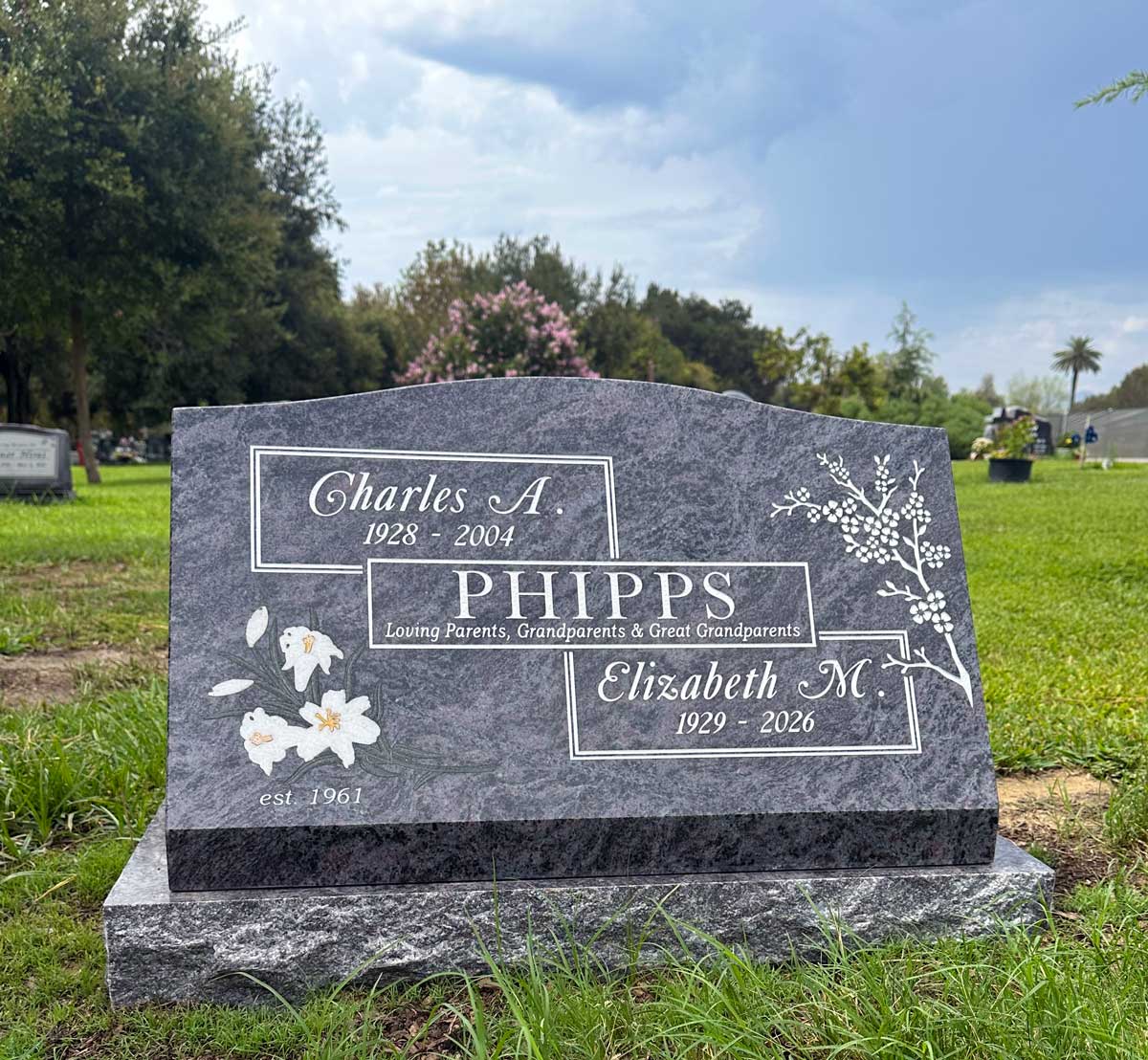 Bahama Blue granite slant memorial with handcrafted white lily inlay, Oak Park Cemetery