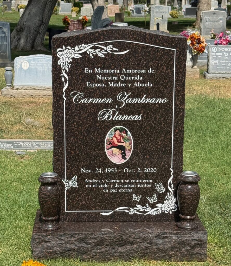 Cats Eye granite upright monument with roses and butterflies, Blancas family