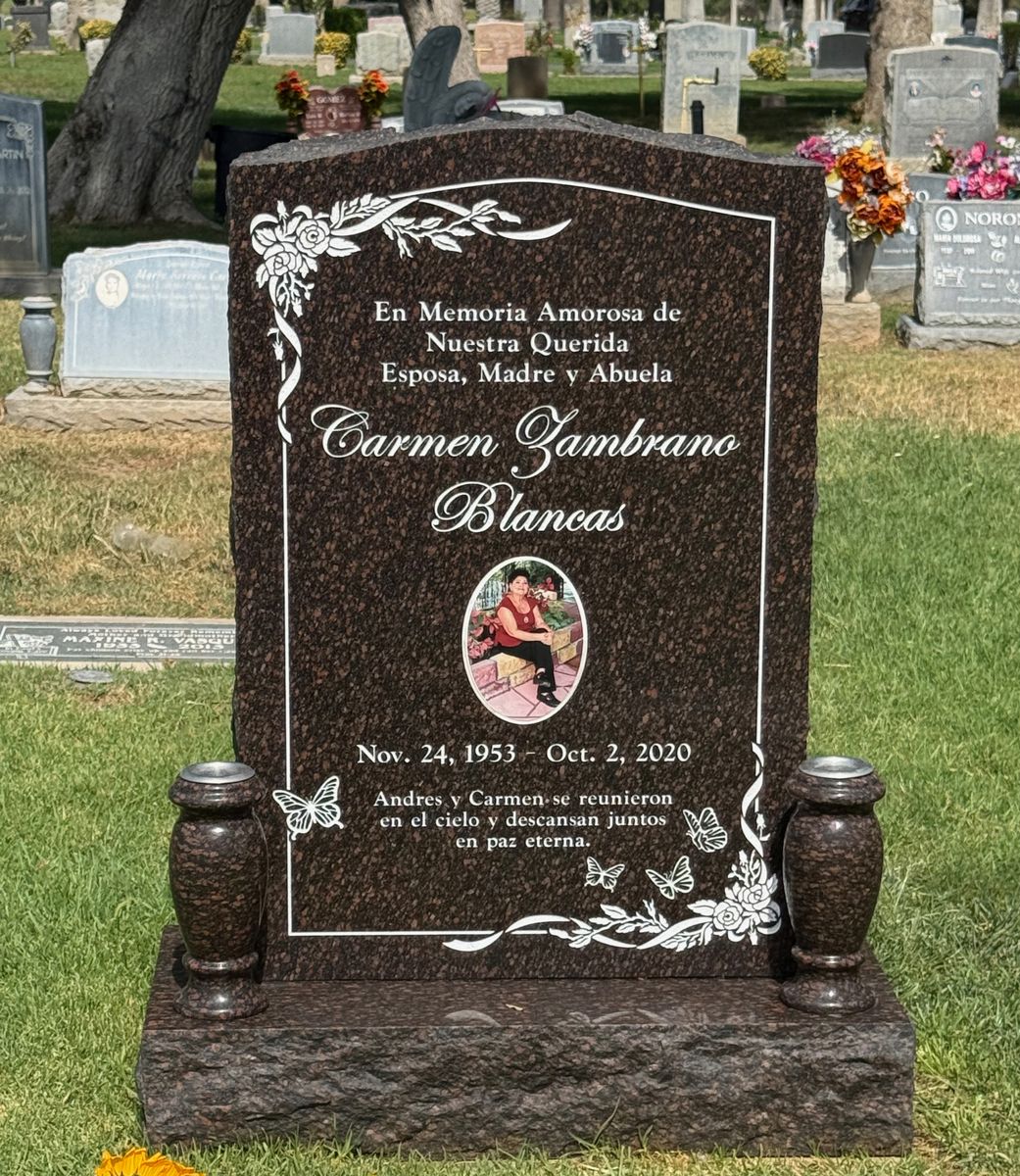 Cats Eye granite upright monument with roses and butterflies, Blancas family