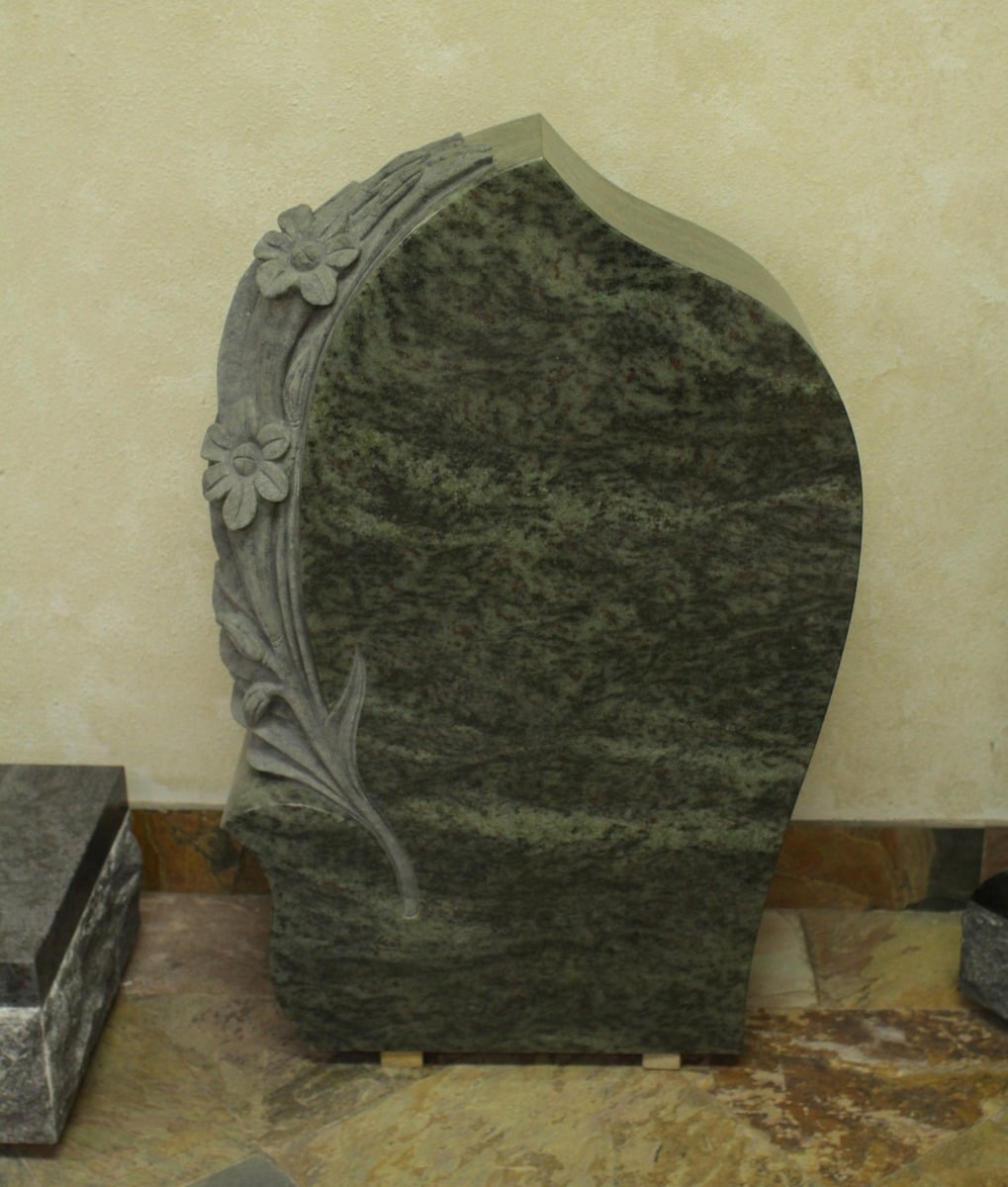 Tropical Green granite upright monument with carved daisy vine