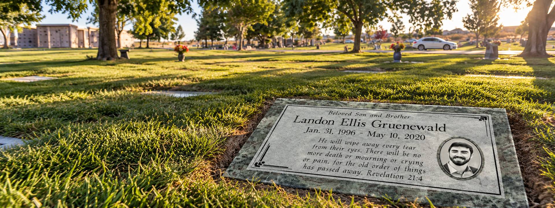 Green granite flat marker with portrait and scripture on the lawn at Desert View Memorial Park, Victorville
