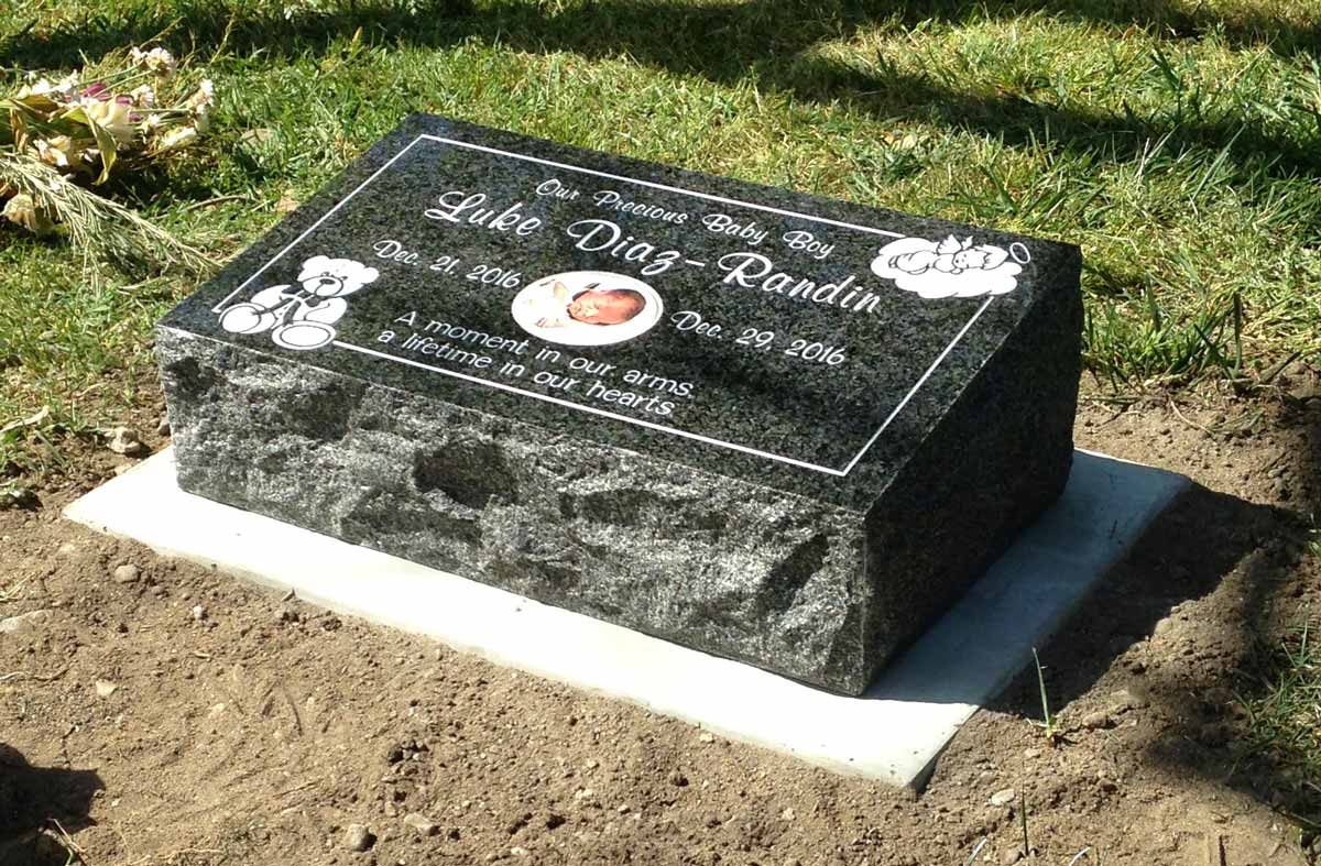 Tropical Green granite headstone with baby, Diaz-Randin family, Oak Park Cemetery
