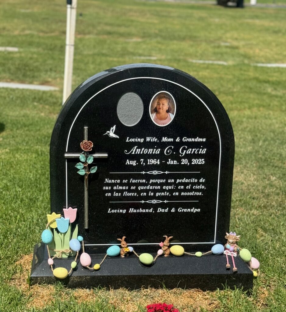 Black granite upright monument with rose cross and hummingbird, Garcia family