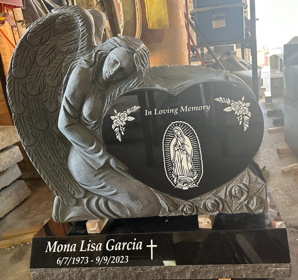 Black granite upright monument with sculpted angel heart, Garcia family, Oak Park Cemetery