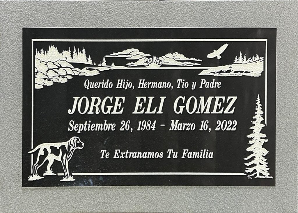 Black granite grave marker with mountain lake and dog, Gomez family, Pomona Valley Memorial Park