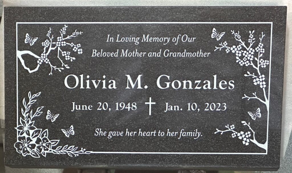 Oxford Gray granite grave stone with blossoms and butterflies, Gonzales family, Queen of Heaven Catholic Cemetery