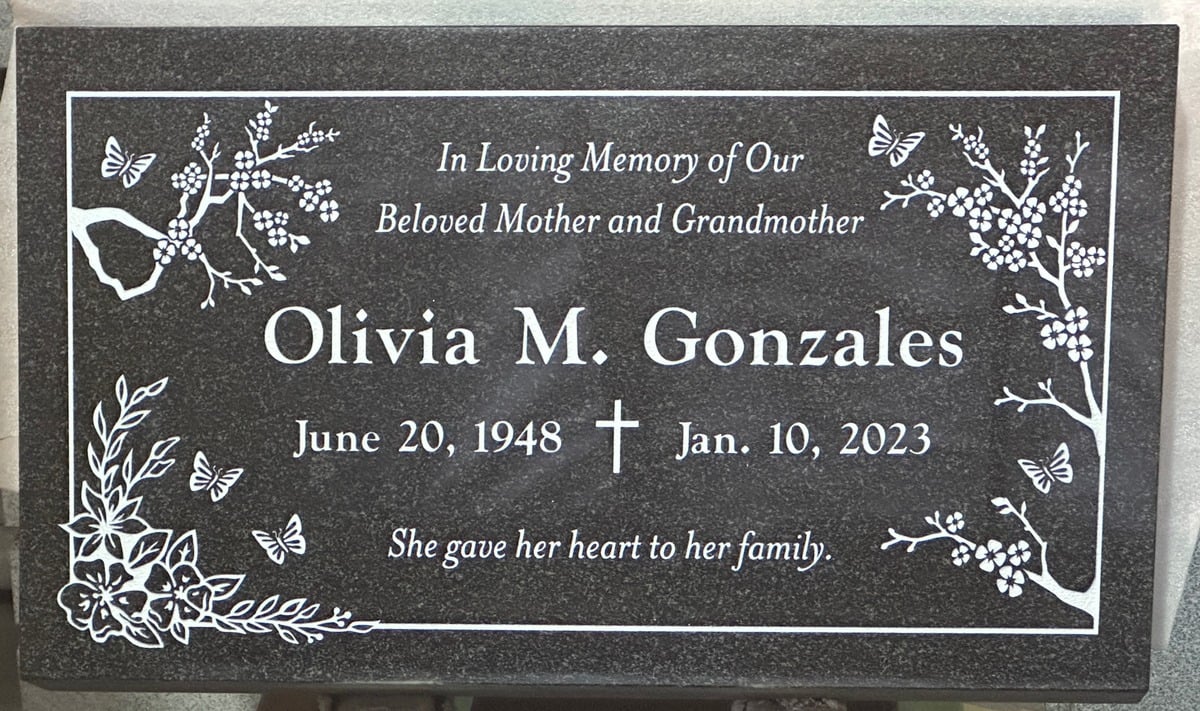Oxford Gray granite grave stone with blossoms and butterflies, Gonzales family, Queen of Heaven Catholic Cemetery