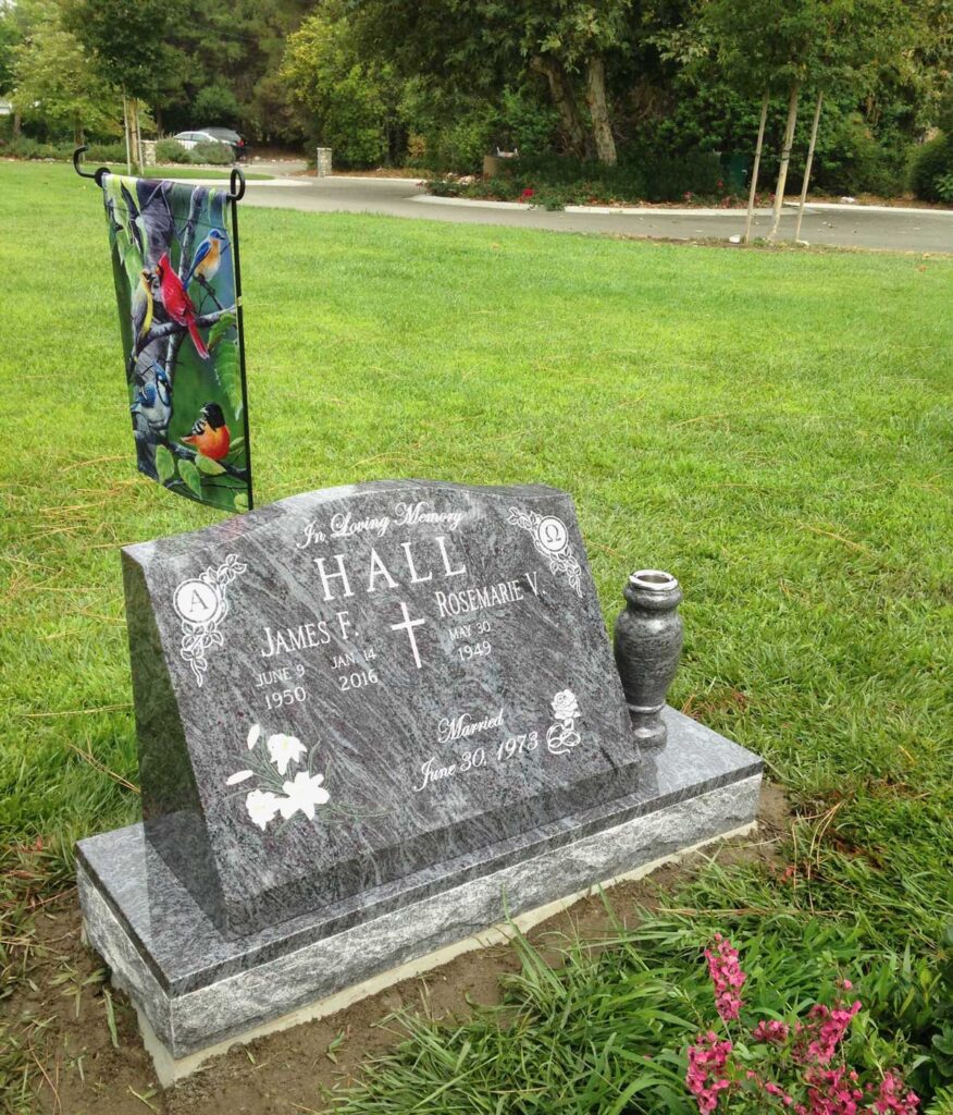 Bahama Blue granite companion slant memorial with cross and lilies, Hall family, Oak Park Cemetery