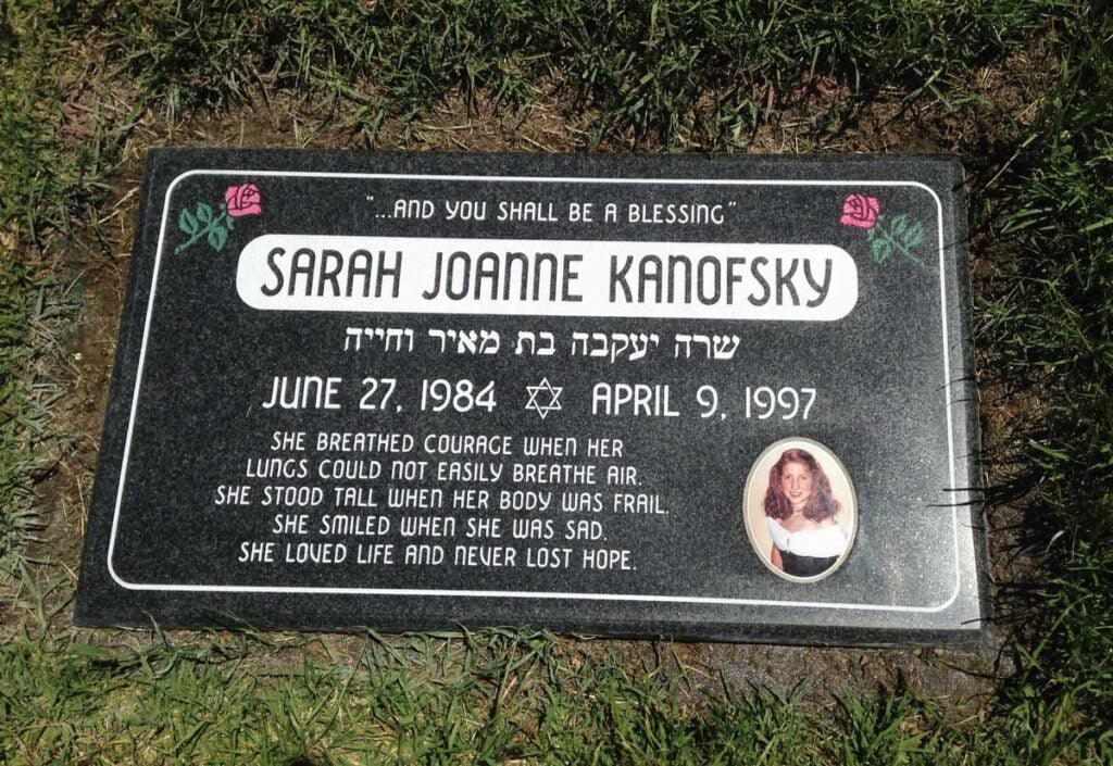 Black granite headstone with roses and portrait, Kanofsky family, Pacific View Memorial Park