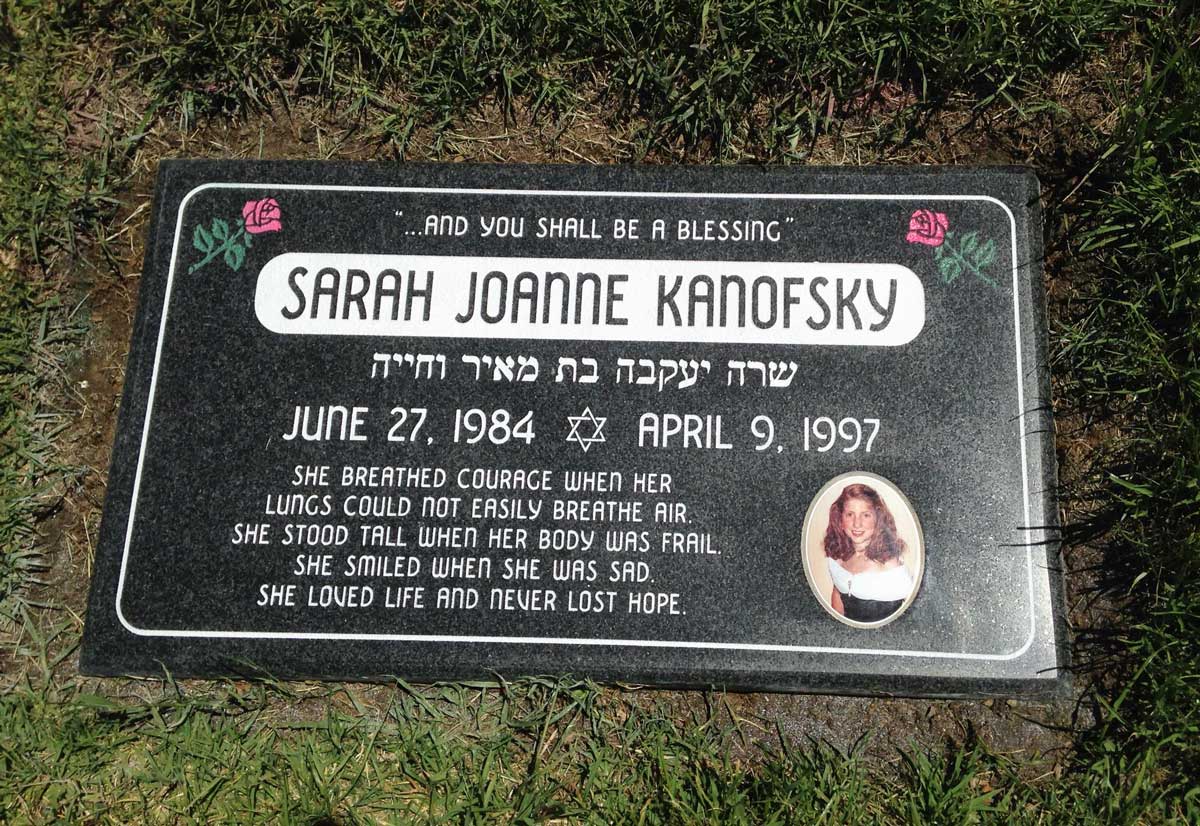 Black granite headstone with roses and portrait, Kanofsky family, Pacific View Memorial Park