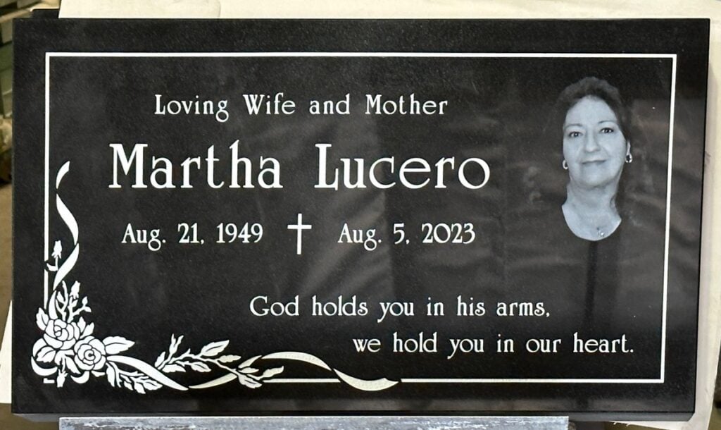 Black granite grave marker with etched portrait and roses, Lucero family, Calvary Cemetery