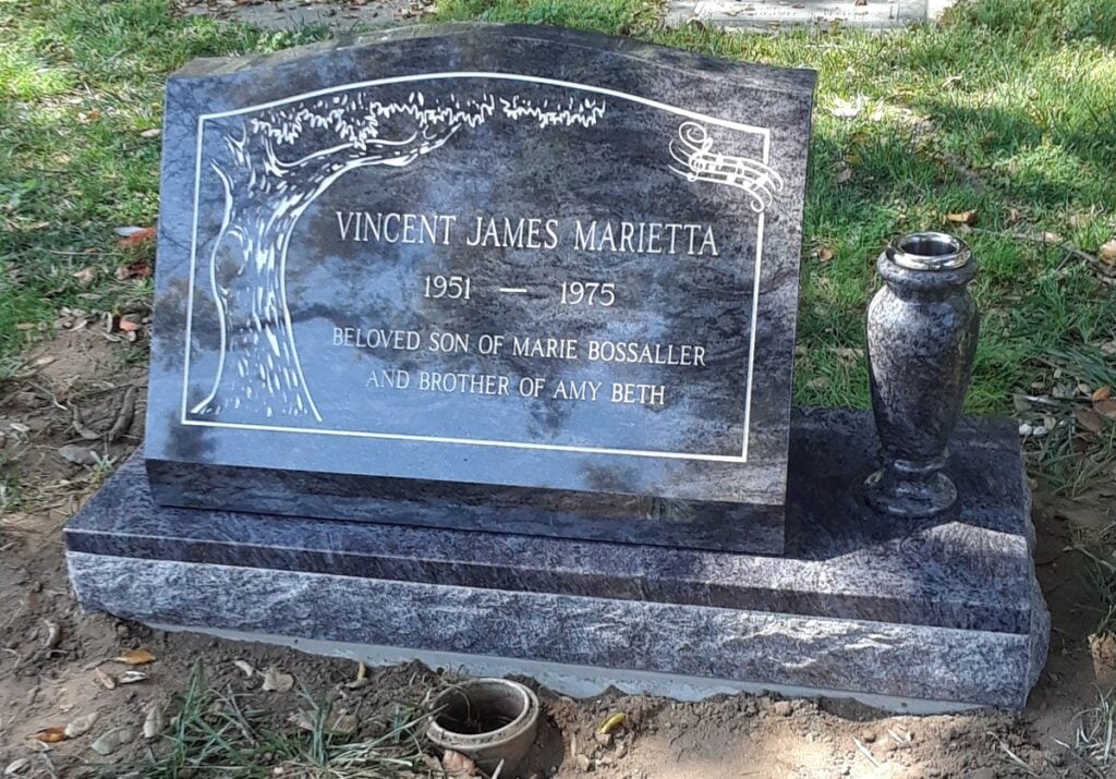 Bahama Blue granite slant memorial with tree and music notes, Marietta family, Oak Park Cemetery