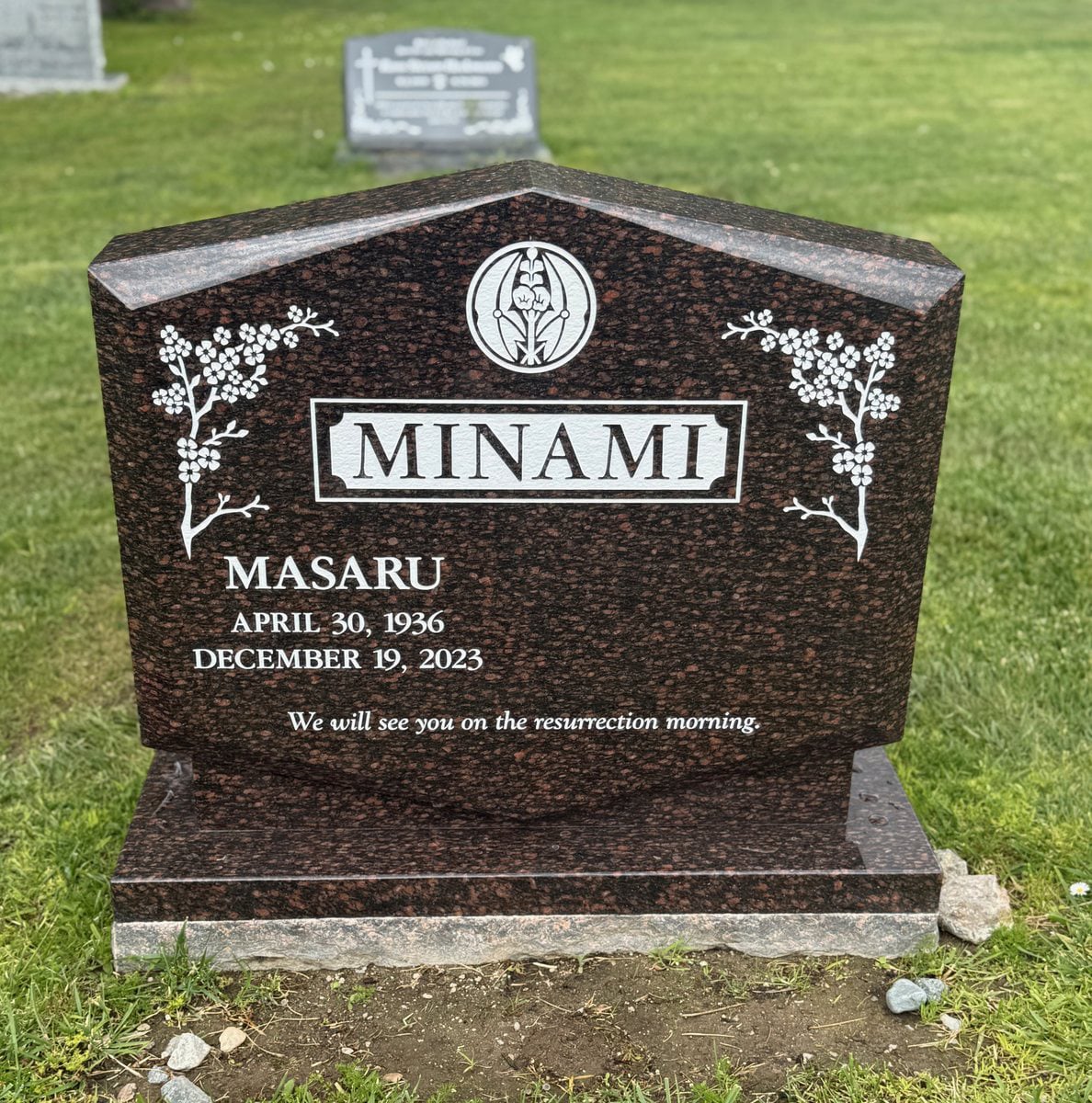 Cats Eye granite upright monument with cherry blossoms and crest, Minami family, Oak Park Cemetery