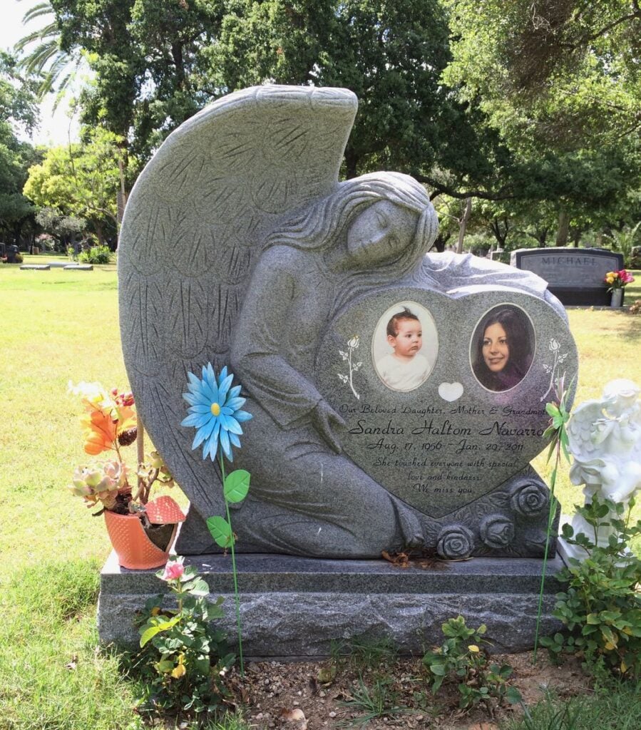 Southern White granite upright monument with sculpted angel with portraits, Navarro family, Oak Park Cemetery