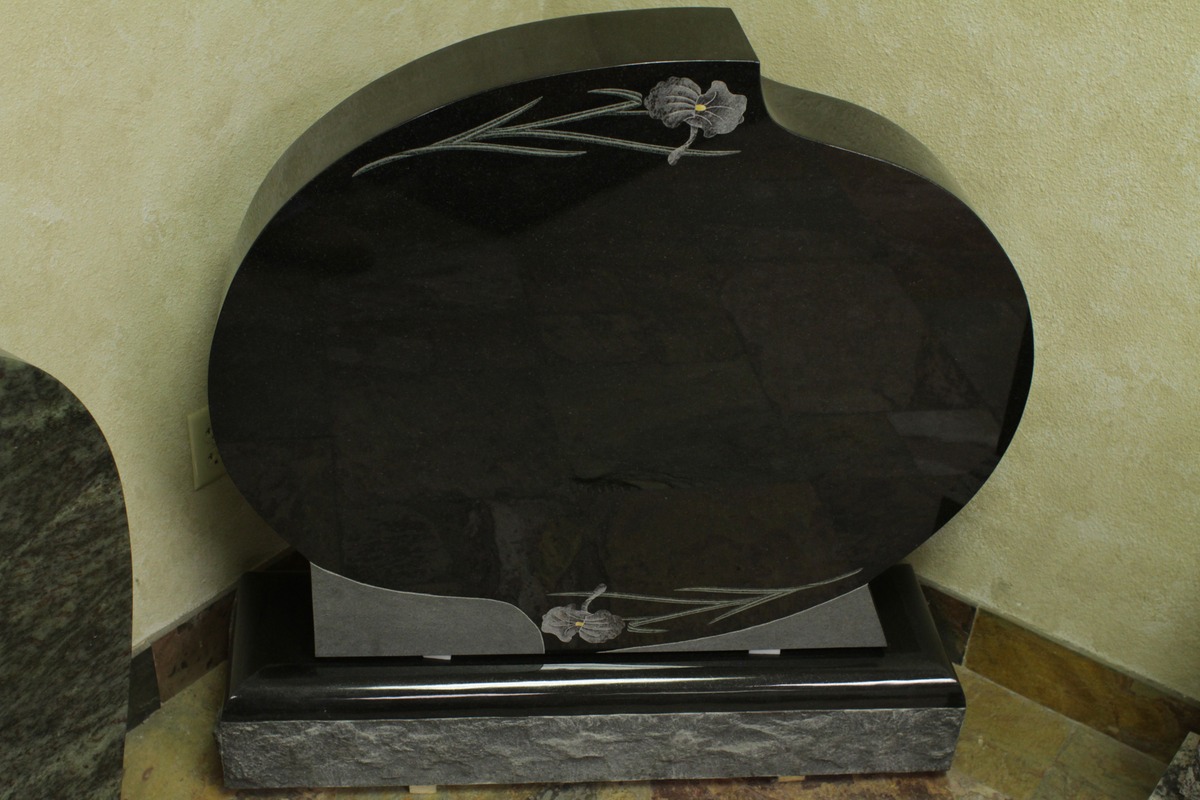 Black granite upright monument with oval etched irises