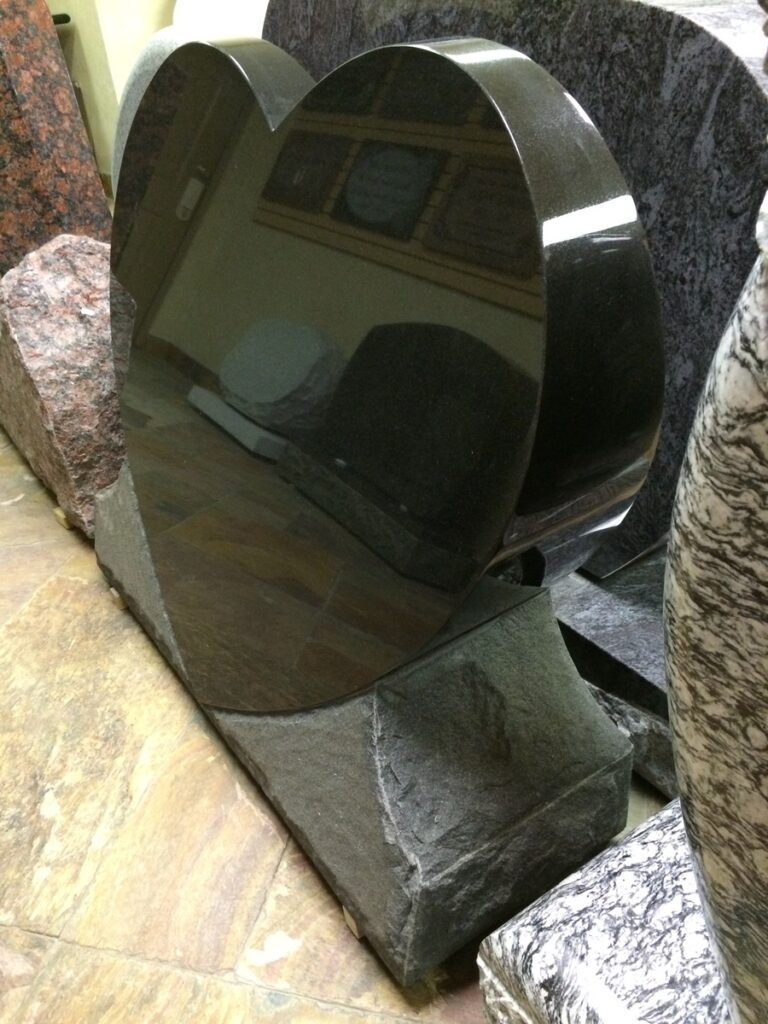 Black granite upright monument with polished heart