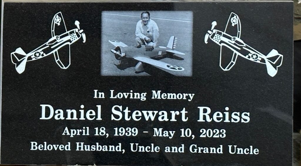 Black granite headstone with model airplanes portrait, Reiss family, Rose Hills Memorial Park