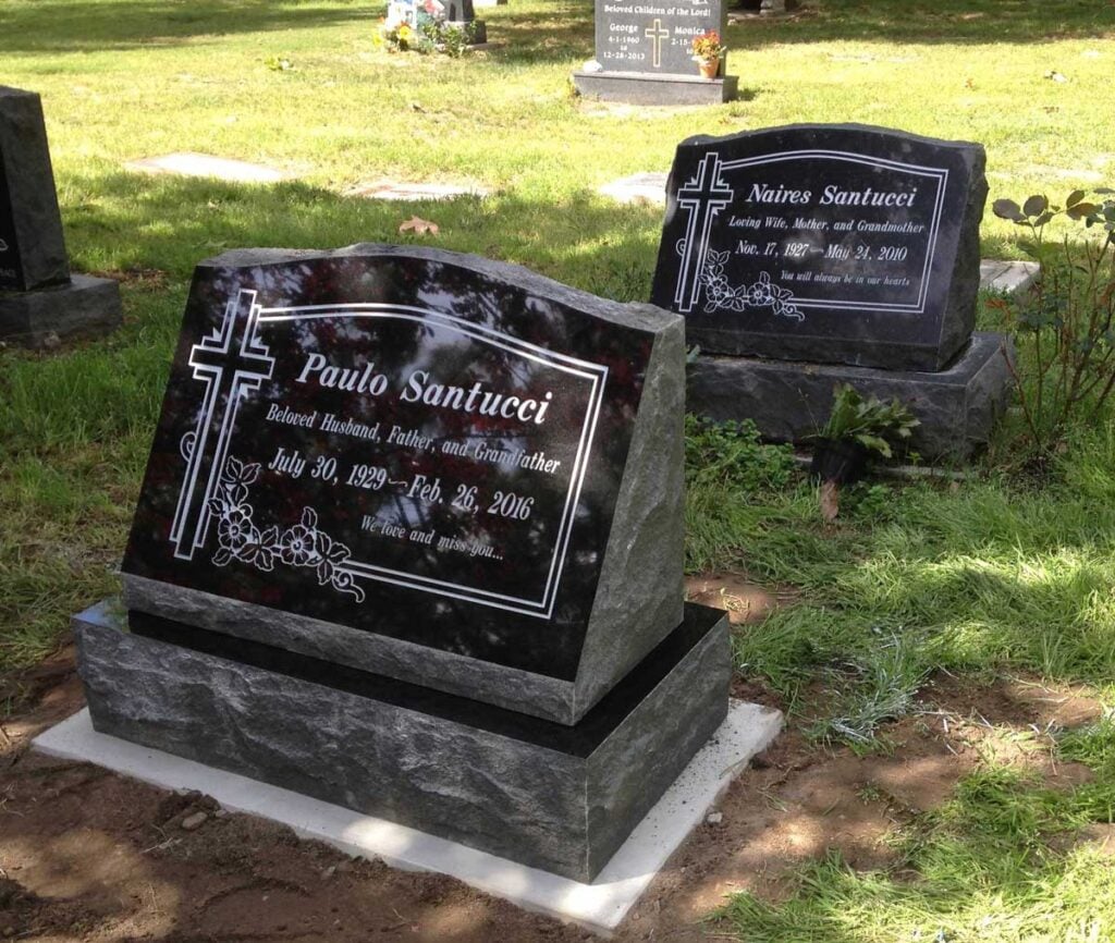 Black granite slant memorial with cross and flowers, Santucci family, Oak Park Cemetery