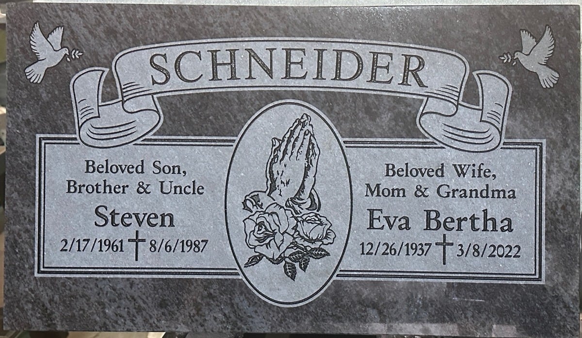 Bahama Blue granite companion grave marker with praying hands and doves, Schneider family, Queen of Heaven Catholic Cemetery