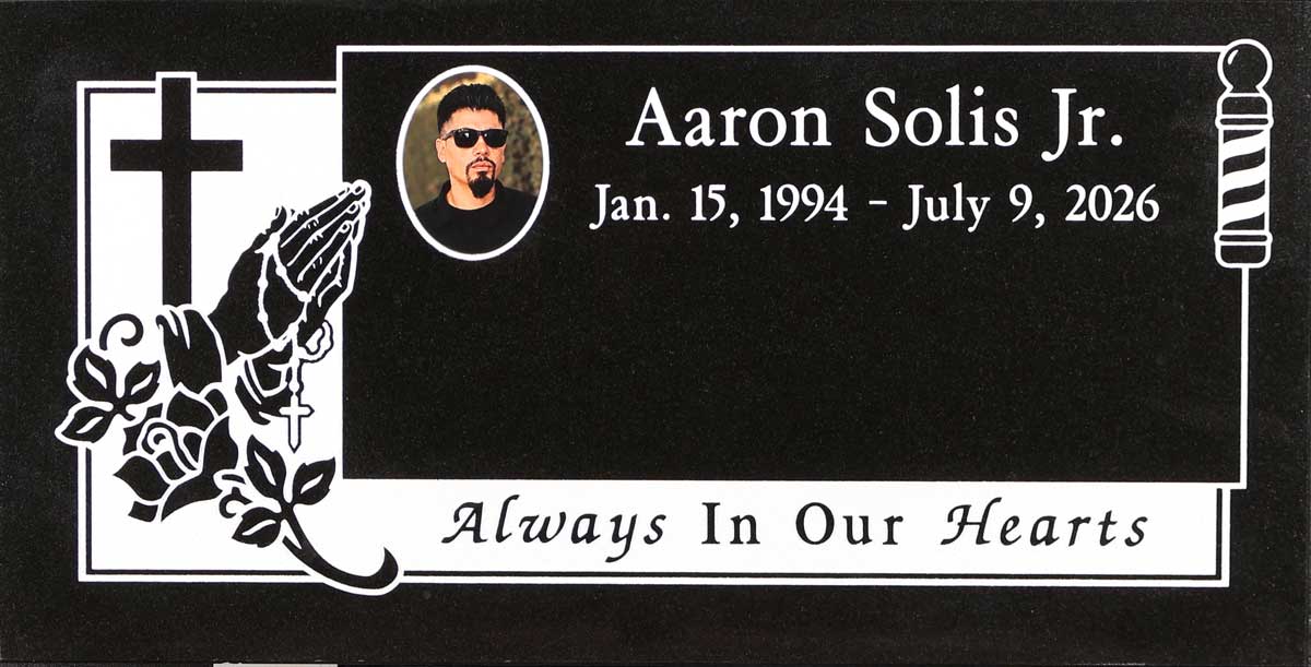 Black granite headstone with praying hands and barber pole, Solis family, Holy Cross Cemetery